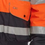 close up of pocket detail on orange and navy hi vis jacket